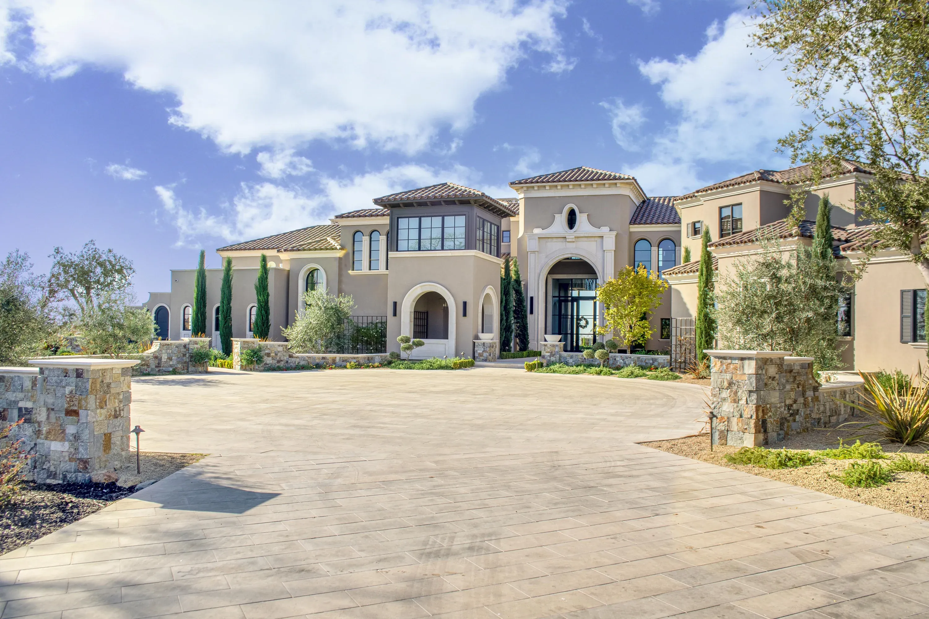Residence featuring Landmark Stone mouldings, columns, sills, surrounds, and landscape elements